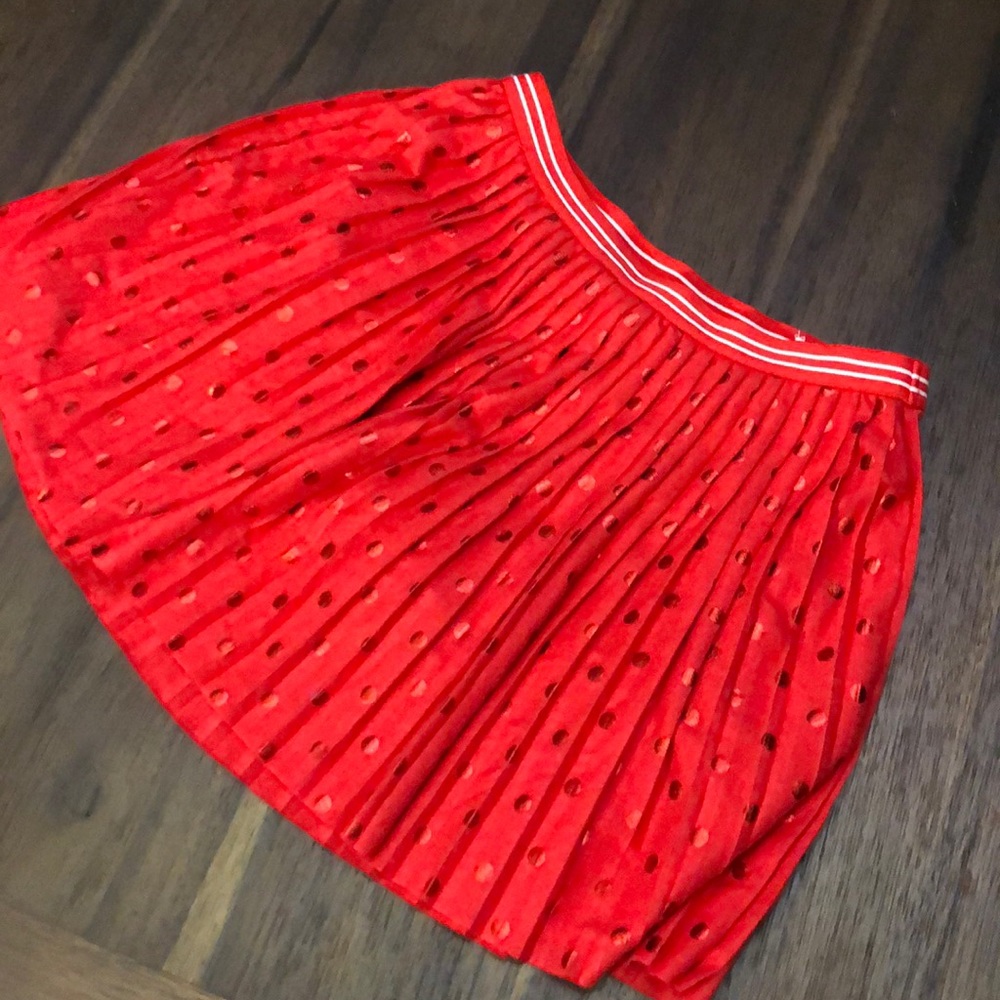 Justice, red skirt .